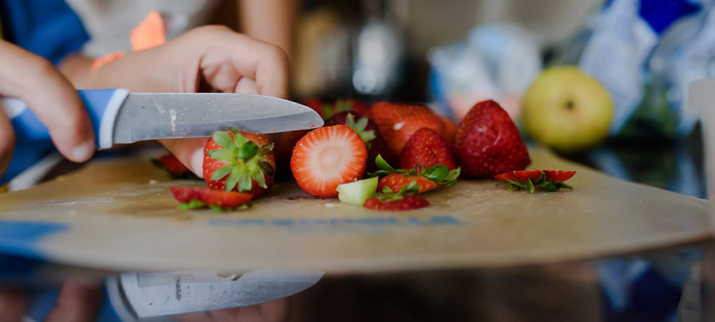 cutting strawberries