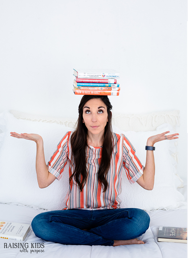 woman balancing books on her head