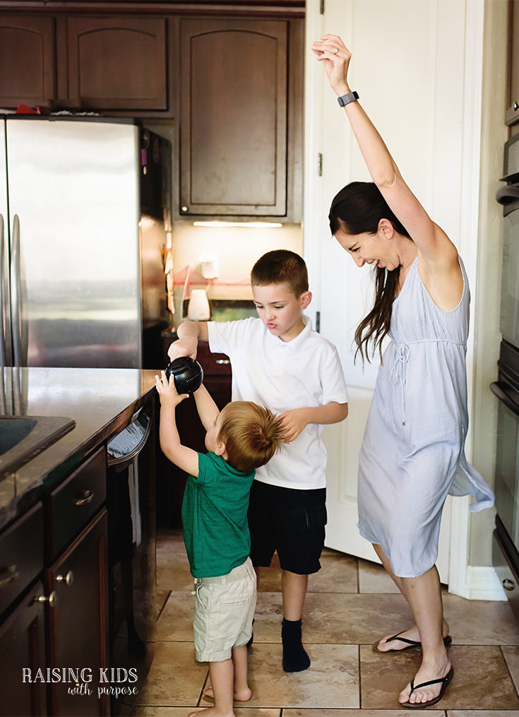 mom dancing in the kitchen with kids