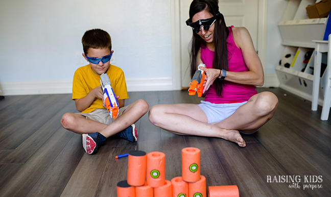 mom and son playing nerf guns