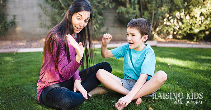 mom teaching the hand model of the brain to son in Arizona backyard