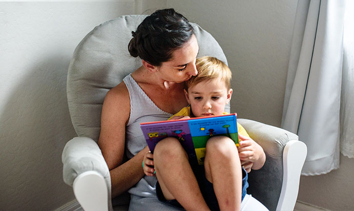 mom reading to boy