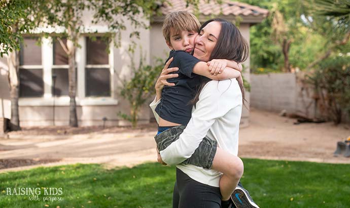 mom and son bear hugging 