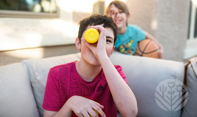 boy looking at Hiya vitamin jar