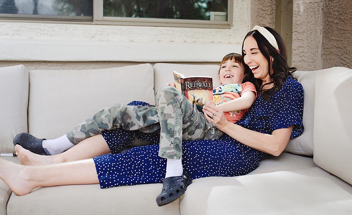 mom and son reading red wall book