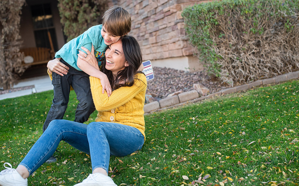 mom and son hugging in Marley Park, in Surprise, AZ