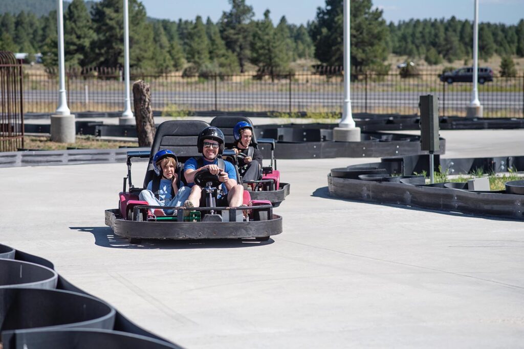 dad and sons go karting part of summer family tradition of camping