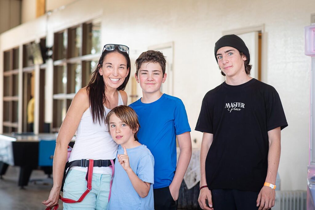 mom and boys at go kart place for a summer family tradition
