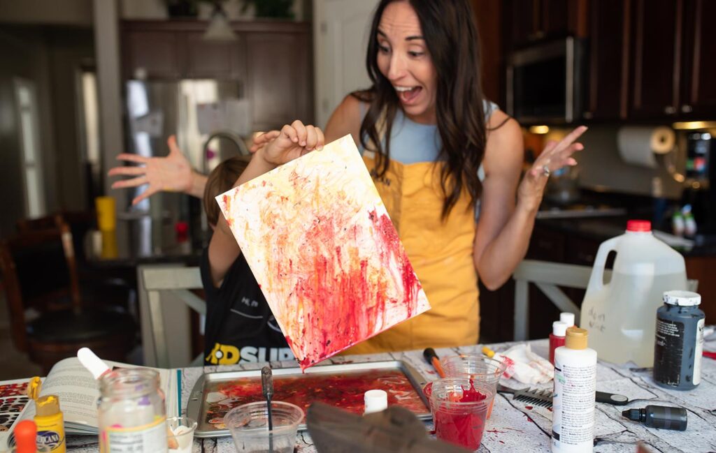 mom surprised at art project son made